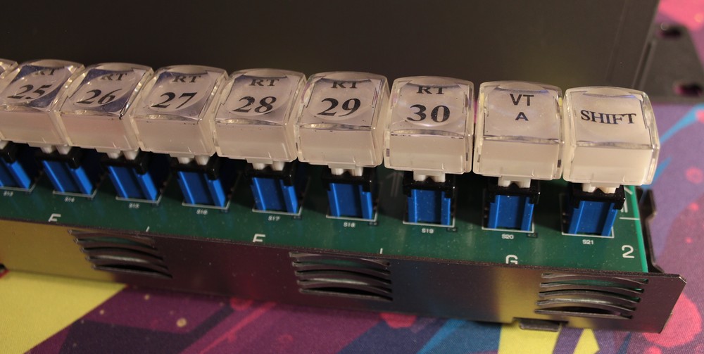 Disasembled router panel showing switches
